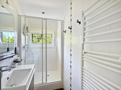 a white bathroom with a shower and a sink at MUD212 2 pieces 4 pers proche centre les Carroz in Les Carroz d'Araches