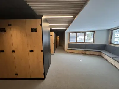 an empty hallway of an office with wooden lockers at Blanc Mont Blanc in Chamonix-Mont-Blanc
