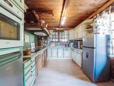 a dining room with a table with plates on it at Apartment Chalet le Prarion by Interhome in Saint-Gervais-les-Bains