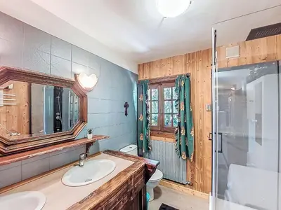 a bedroom with a bed with a wooden ceiling at Apartment Chalet le Prarion by Interhome in Saint-Gervais-les-Bains