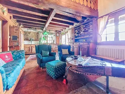 a living room with a couch and a table at Apartment Chalet le Prarion by Interhome in Saint-Gervais-les-Bains