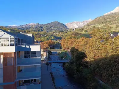 a view of a river with mountains in the background at Le Méribel - Terrasse 83m2 - Vue Mont-Blanc in Sallanches