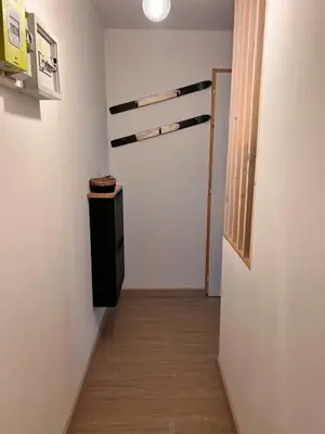 a room with a hallway with a wooden floor at Joli studio hypercentre in Les Carroz d'Araches