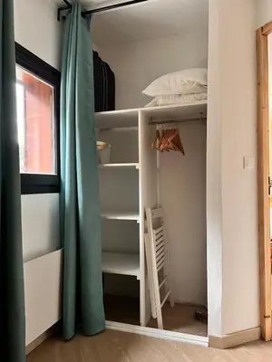 a room with bunk beds and a window at Joli studio hypercentre in Les Carroz d'Araches