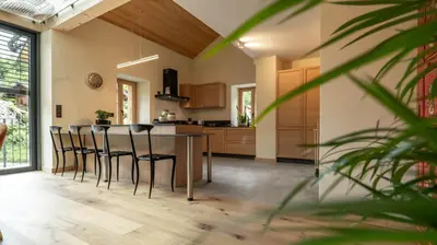 a kitchen with a table and chairs in a room at Enjoy Chalet in Chamonix-Mont-Blanc