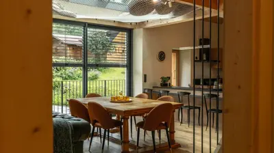 a dining room with a wooden table and chairs at Enjoy Chalet in Chamonix-Mont-Blanc