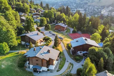 an aerial view of a home in a forest at Appartement Bridan - Welkeys in Megève
