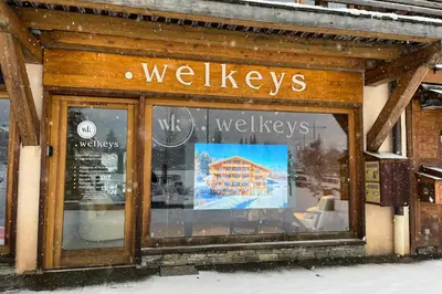 a store window with the words walesleys on it at Appartement Bridan - Welkeys in Megève