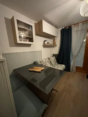 a small room with a table and a chair at Au nid du Lay in Les Contamines-Montjoie
