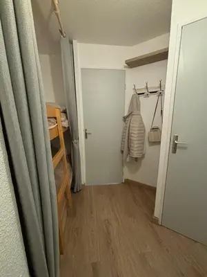 a small room with a closet and a door at Au nid du Lay in Les Contamines-Montjoie