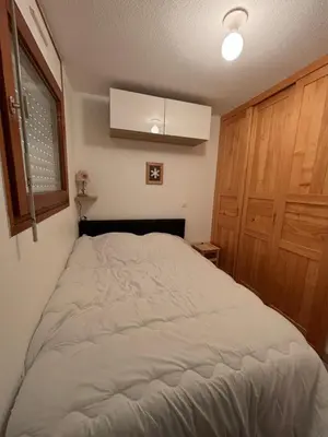 a bedroom with a large bed in a room at Au nid du Lay in Les Contamines-Montjoie