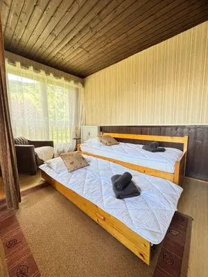 a bedroom with two beds with towels on them at Charming studio near the slopes and the city in Megève
