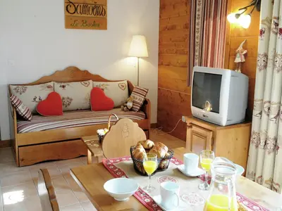 a large building with snow on the ground at Charming Mountain Getaway in Samoëns