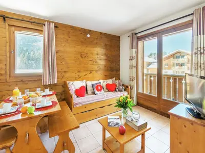 an empty swimming pool with blue floors and windows at Charming Mountain Getaway in Samoëns