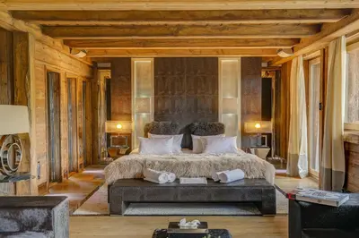 a bedroom with a large bed in a room at Megeve Luxury Estate The Royal Alpine Retreat with Mont Blanc View - Chalet Maille in Demi-Quartier