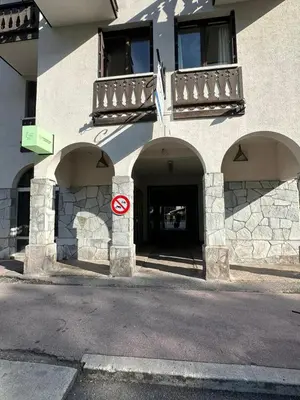 a building with a no parking sign in front of it at L'appart 313 - La Forclaz in Chamonix-Mont-Blanc