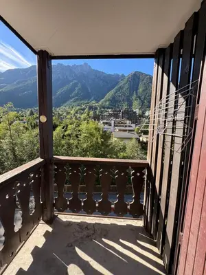 a balcony with a view of the mountains at L'appart 313 - La Forclaz in Chamonix-Mont-Blanc