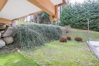 a pile of grass on the side of a house at Appartement Vinson - Welkeys in Megève