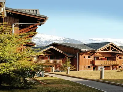 a room with a table and chairs and a dining room at Mountain Retreat for Families in Samoëns