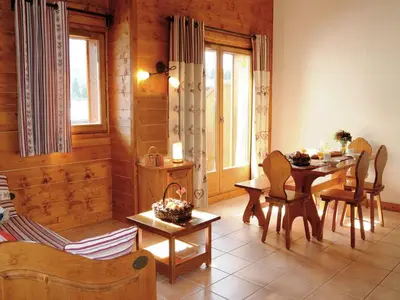 a swimming pool in a house with large windows at Mountain Retreat for Families in Samoëns