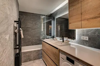 a bathroom with a sink and a mirror at Apartment Castorettes, Alpes Trave, Sleeps 6 to 7 in Chamonix-Mont-Blanc