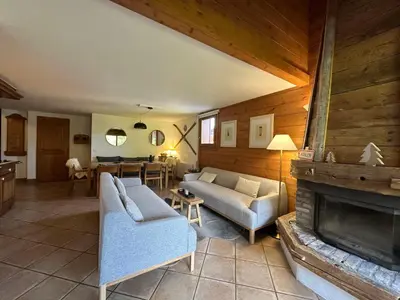 a living room with a couch and a fireplace at Appartement confortable au pied des pistes pour 8 personnes - FR-1-642-104 in Morillon