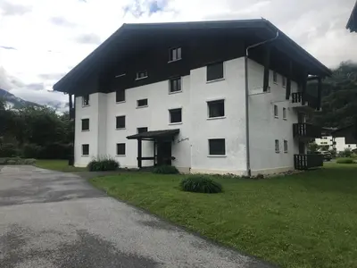 a large white building with a black roof at Samoëns studio 4 personnes idéalement situé in Samoëns