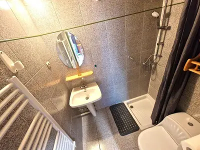 a small bathroom with a sink and a mirror at Appartement Lyret, Chamonix Centre, 4 personnes in Chamonix-Mont-Blanc