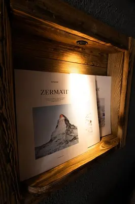 a kitchen with a lamp in the corner of a room at Chalet studio Megève enface des remontées mécaniques et parking gratuit in Demi-Quartier