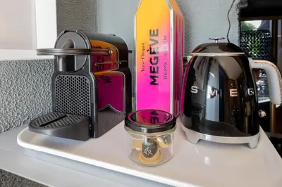 a coffeemaker and a tea kettle on a counter at Chalet studio Megève enface des remontées mécaniques et parking gratuit in Demi-Quartier
