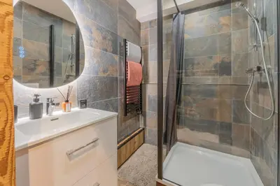 a bathroom with a sink and a shower at Chalet studio Megève enface des remontées mécaniques et parking gratuit in Demi-Quartier