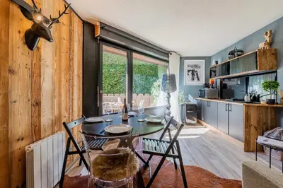 a tray of food on a table with a slice of tree stump gmaxwell gmaxwellzos at Chalet studio Megève enface des remontées mécaniques et parking gratuit in Demi-Quartier