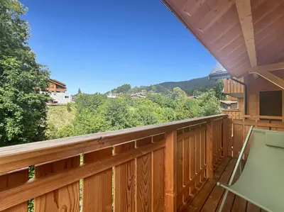 a deck with a view of the mountains at DBA202 - Appartement standing 4-5 pers in Les Carroz d'Araches