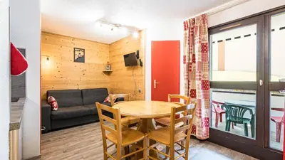 a room with a table and chairs and a couch at Grande Neige N 10 - 2P4 in Morillon