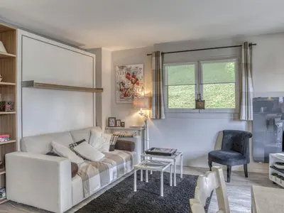 a living room with a couch and a chair at Appartement 2 pièces pour 4 pers. à Megève avec Parking et Wifi, proche centre - FR-1-453-307 in Megève