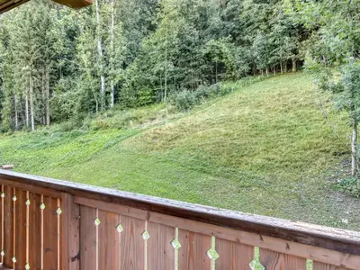 a wooden fence with a grassy hill behind it at Appartement 2 pièces pour 4 pers. à Megève avec Parking et Wifi, proche centre - FR-1-453-307 in Megève
