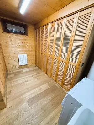 a small room with wooden walls and wood floors at Megève centre in Megève