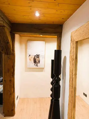 a room with a picture of two sheep on the wall at Megève centre in Megève