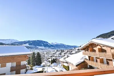 a view from the balcony of a hotel in the snow at Étoile Front de Neige in Demi-Quartier