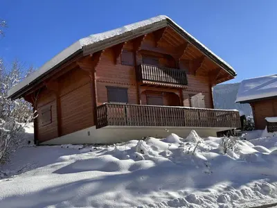 a log cabin in the snow with snow at Chalet typique 5 chambres pour 10 personnes avec Wi-Fi et terrasse - FR-1-572-303 in Arâches-la-Frasse