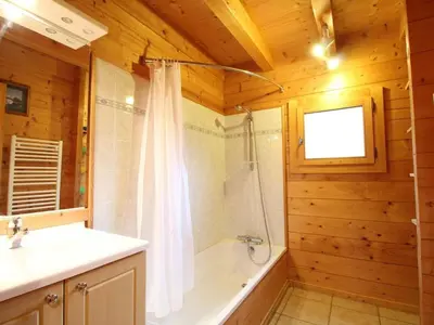 a bathroom with a shower and a tub and a sink at Chalet typique 5 chambres pour 10 personnes avec Wi-Fi et terrasse - FR-1-572-303 in Arâches-la-Frasse