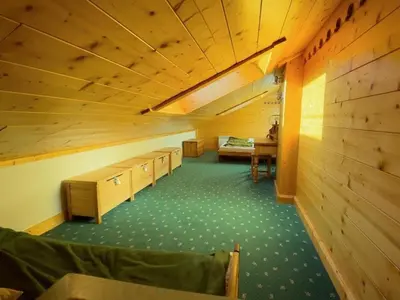 an attic room with desks and a bed in it at Appartement spacieux 70m², balcon, parking privatif, 6 personnes - FR-1-572-333 in Arâches-la-Frasse