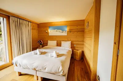 a jacuzzi tub sitting on a deck at Chalet des Sommets in Combloux