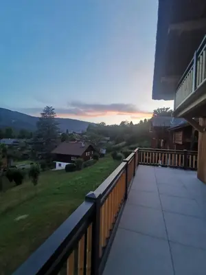 a balcony with a view of a house at Chalet Le M - Adults only - Standing - Samoëns Grand-Massif in Samoëns