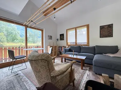 a living room with a couch and chairs and a table at Apartment in Chamonix in Chamonix-Mont-Blanc
