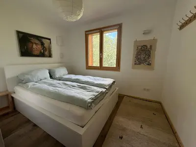 a bedroom with a bed in the corner of a room at Apartment in Chamonix in Chamonix-Mont-Blanc
