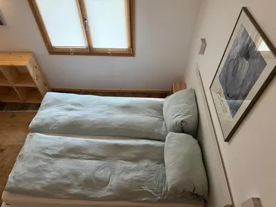 a room with two beds and a window at Apartment in Chamonix in Chamonix-Mont-Blanc