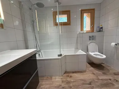 a bathroom with a tub and a toilet and a sink at Apartment in Chamonix in Chamonix-Mont-Blanc