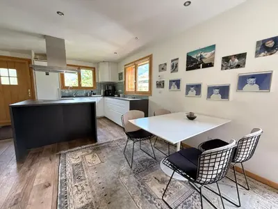 a kitchen with a white table and chairs at Apartment in Chamonix in Chamonix-Mont-Blanc