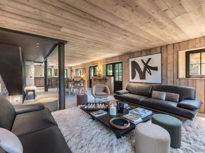 a living room with a couch and a table at Chalet calme à Megève - 4 chambres, proche centre, parking inclus - FR-1-569-201 in Megève